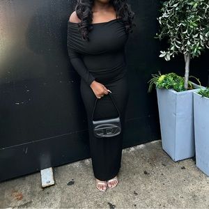 black, long-sleeve maxi dress made stretch fabric and off-the-shoulder overlay